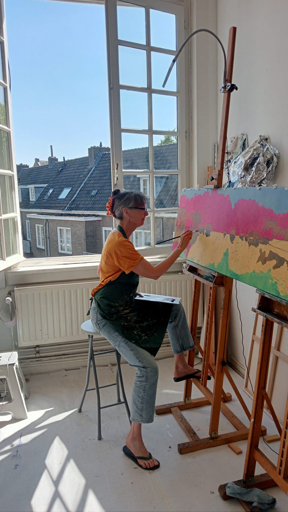 Artist in studio painting